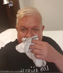 U98829376 - Freshly worn grey Nike socks off of the Bosses sweaty feet